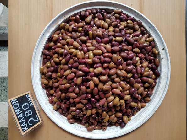 Athens: The Classic Food Tasting Tour - The Cretan tasting round: cheese, olives, rusks, olive oil, and raki